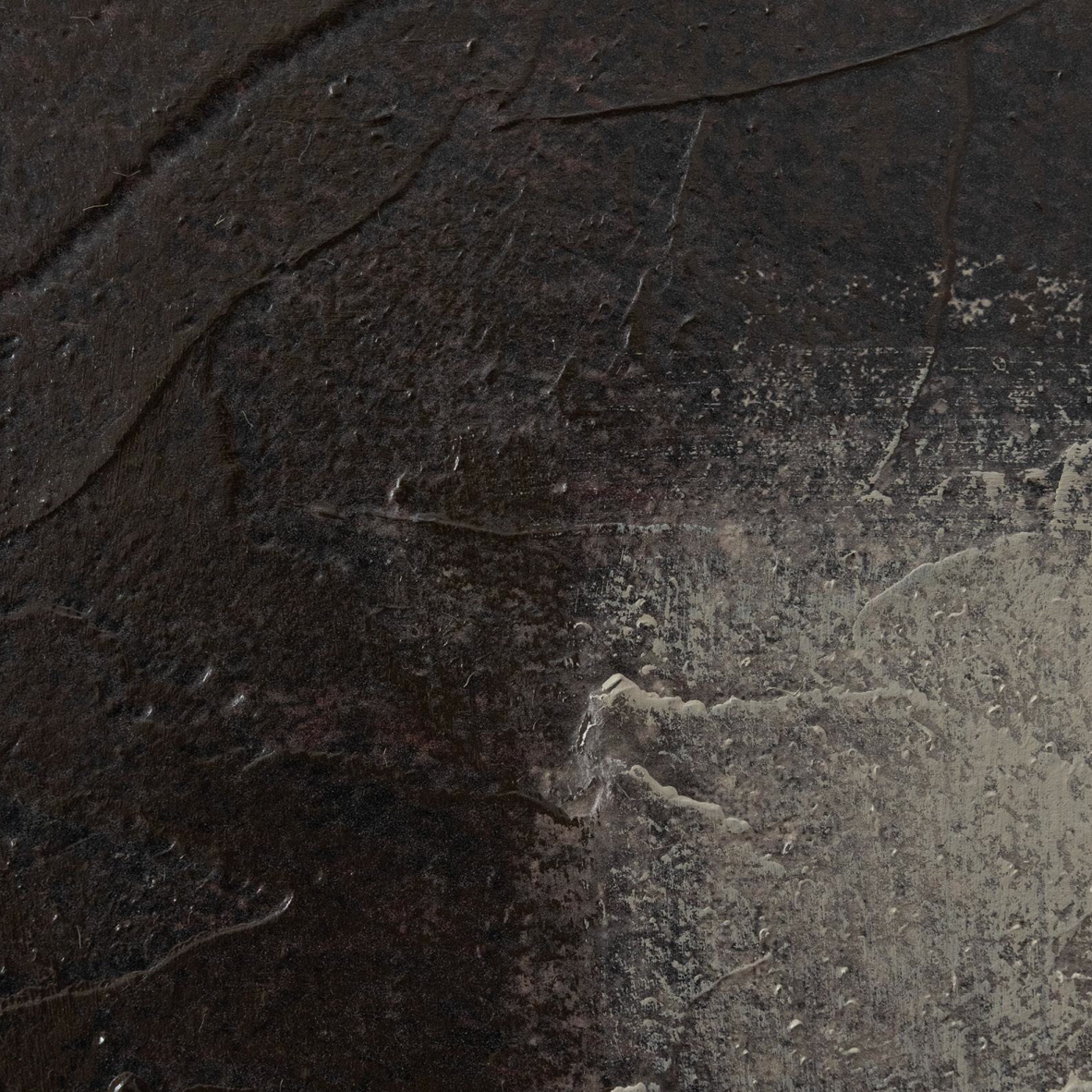 Dark charcoal gray to black textured surface with subtle stone-like or concrete-like grain and lighter gray wear marks.