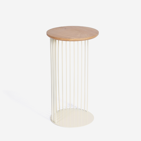 An end table in cream with an oak table top on a white background